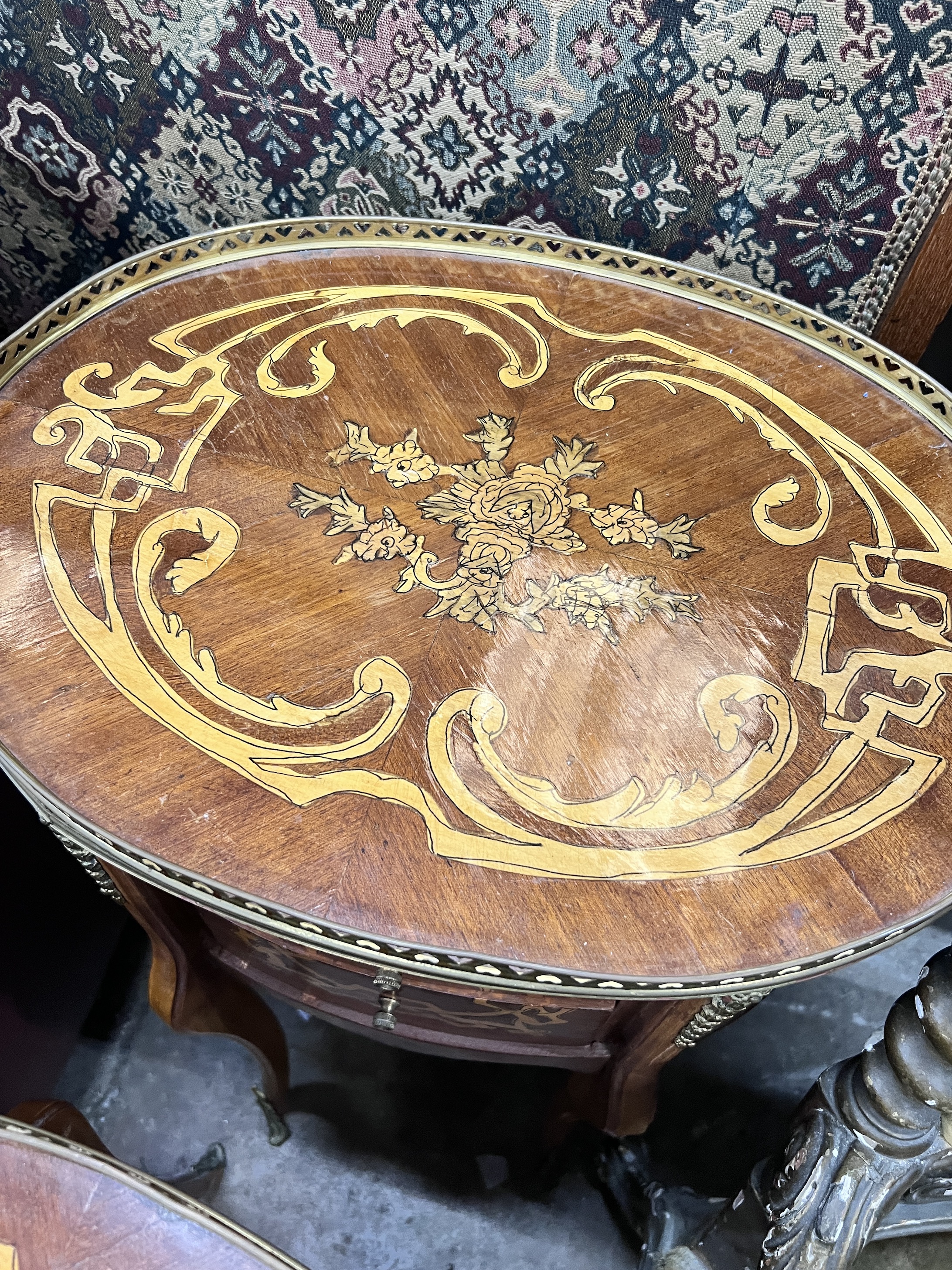 A pair of reproduction Louis XV style oval marquetry inlaid bedside chests, width 47cm, depth 36cm, height 77cm